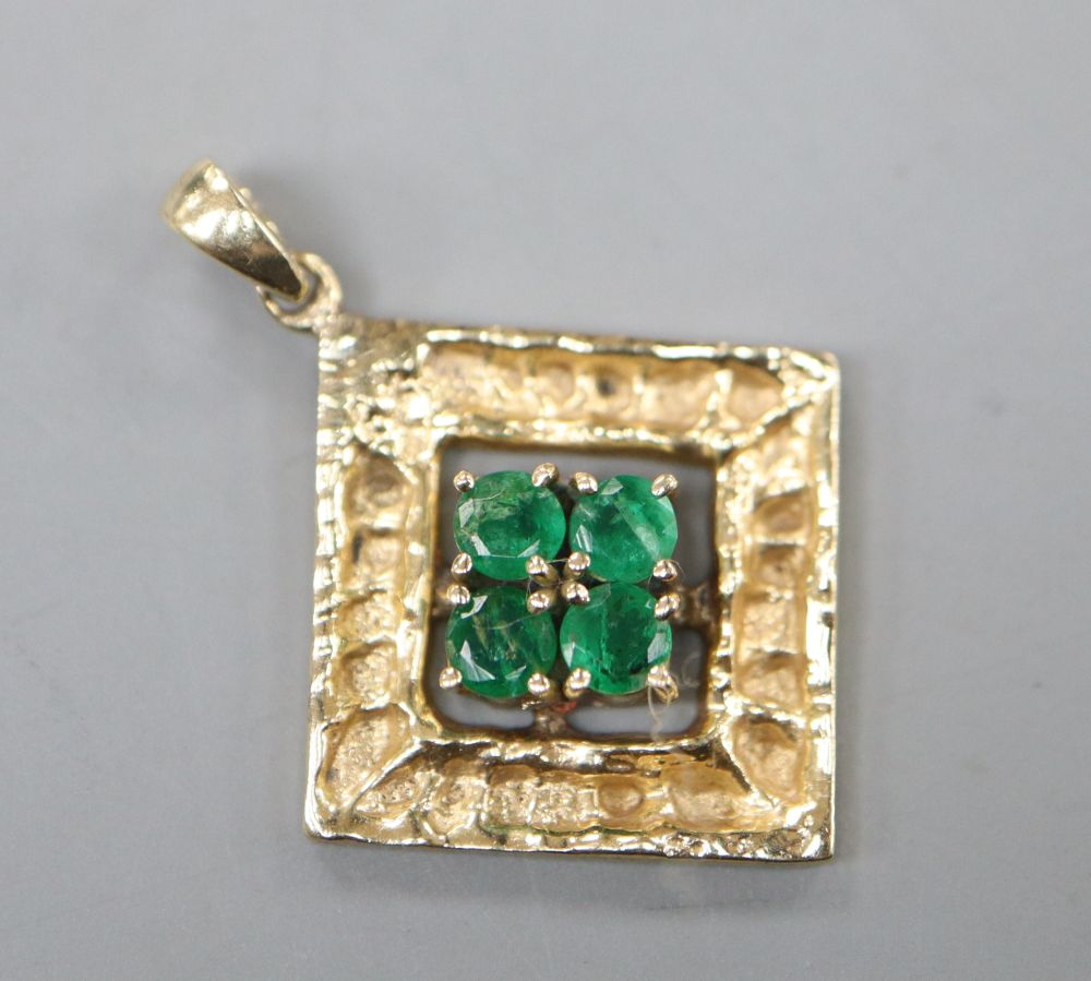A modern 14k and four stone emerald set diamond shaped pendant, 20mm, gross 2.1 grams.